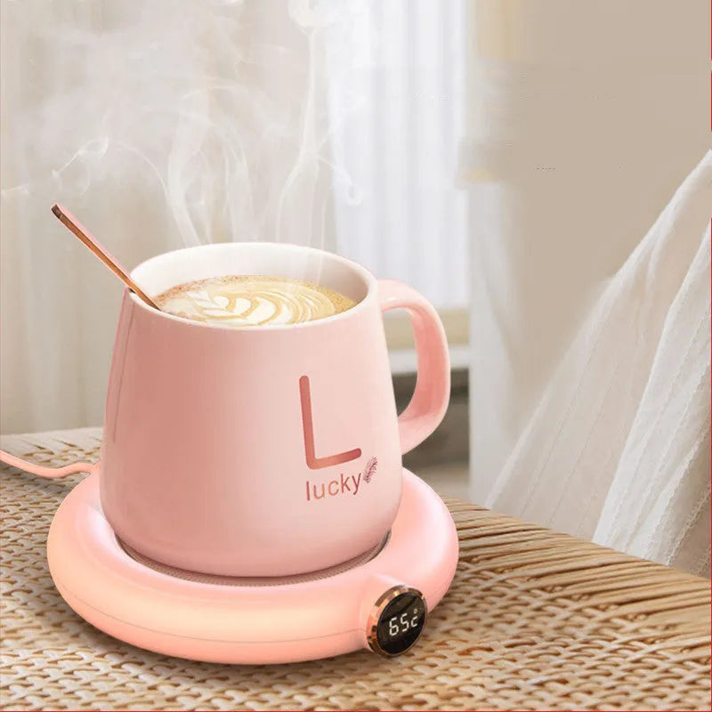 USB cup warmer pad with LED display showing temperature setting, on a desk with a mug of coffee