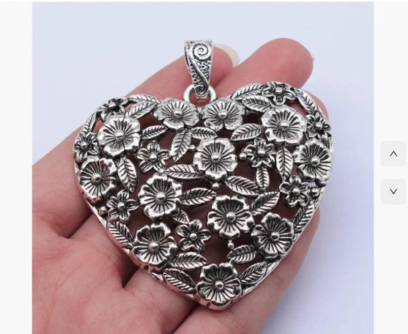 Hollow flower love pendant in ancient silver alloy measuring 67x58mm