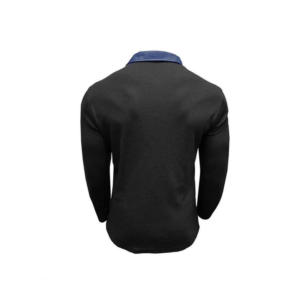 Man wearing a long-sleeved waffle texture polo shirt in a solid colour with a loose, retro fit.