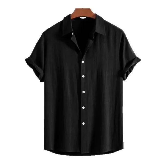 A man wearing a loose-fit black short-sleeve cardigan shirt for casual summer wear.