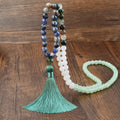 Handmade Bohemian long necklace with natural stone tassel and geometric mixed gem pendant.