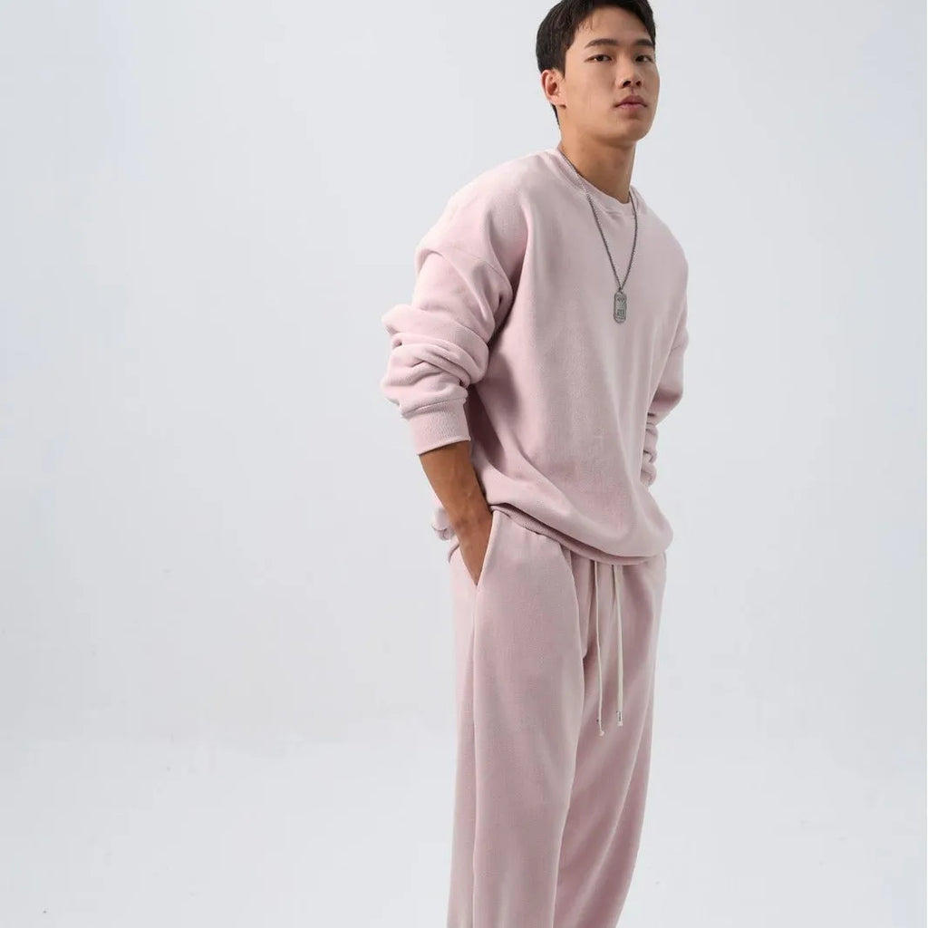 Men's loose fit polar fleece sports suit in winter colours, showing coat and trousers.