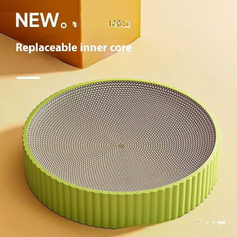 Round green and white cat scratching board nest measuring 55cm with corrugated paper surface.