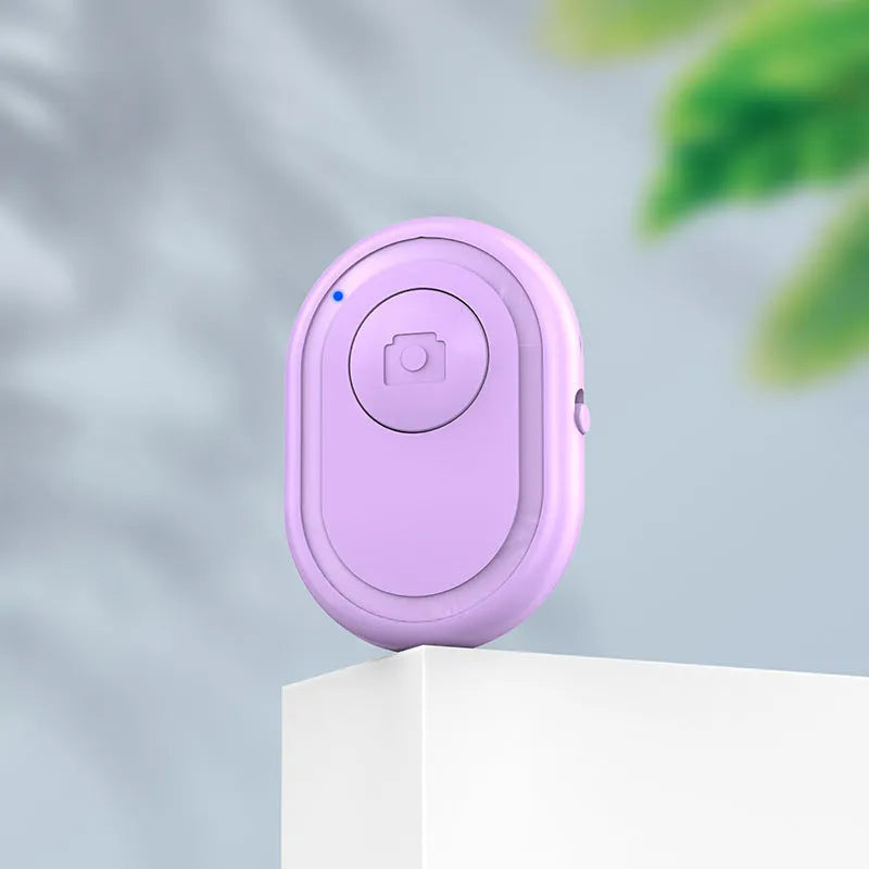 Wireless Bluetooth remote self-timer photo control in black, plastic compact 48mm size