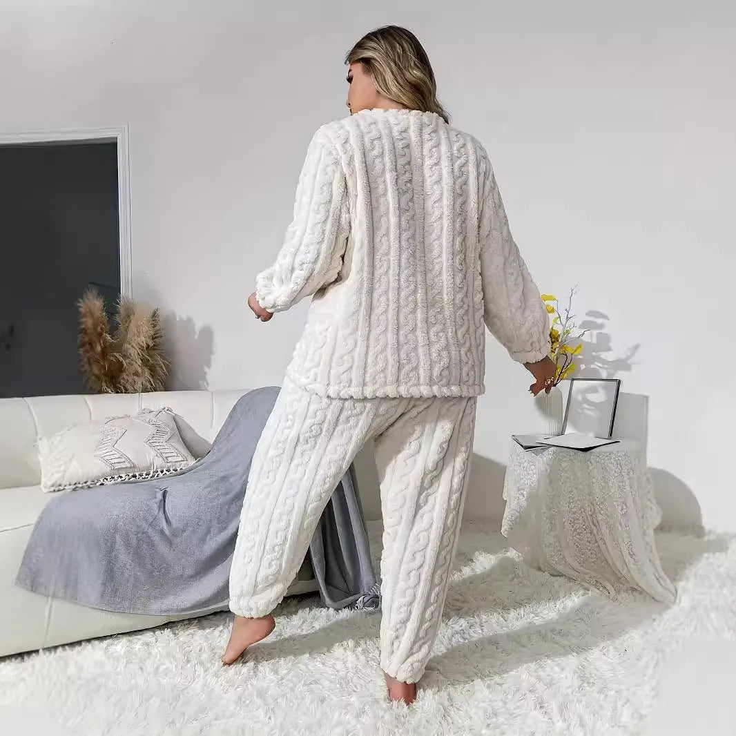 Women's creamy white polyester two-piece suit with crew neck top and matching trousers