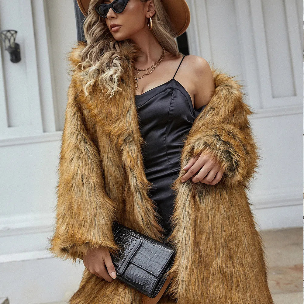 Yellow loose women's artificial fur coat with regular sleeves on a hanger