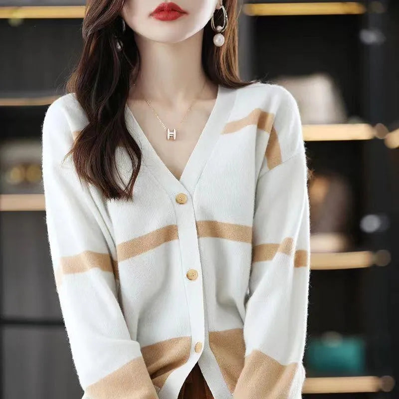 Women's black and white 3D striped knitted cardigan with button front and V-neck on a slim fit.