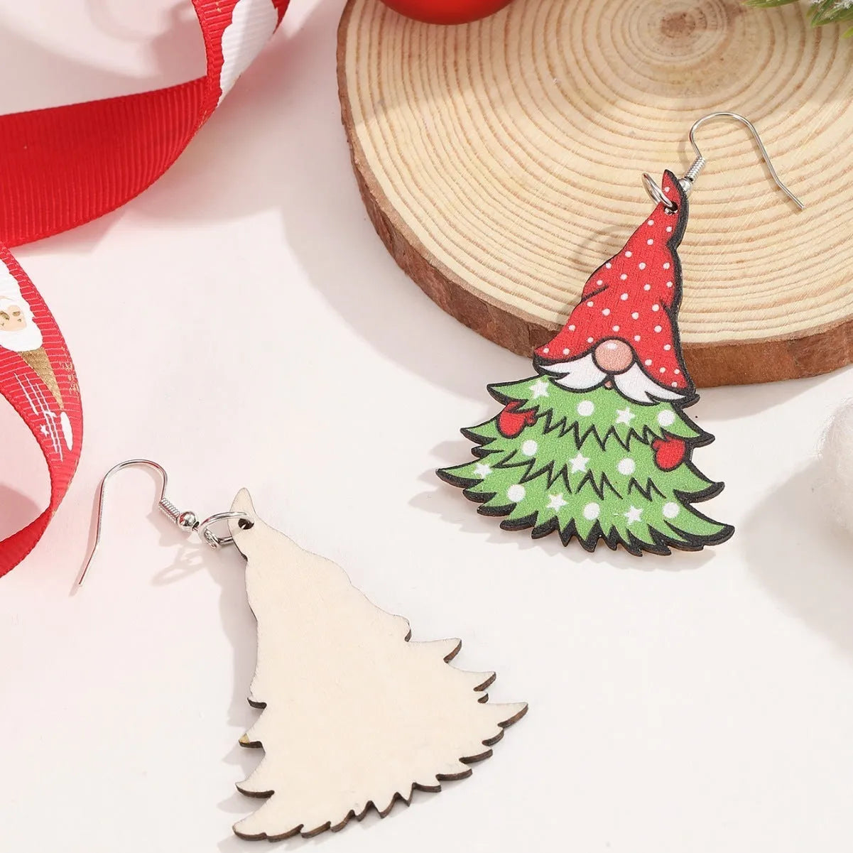 Women's wooden Christmas earrings showing Christmas tree and water drop snowman designs with Santa Claus elements