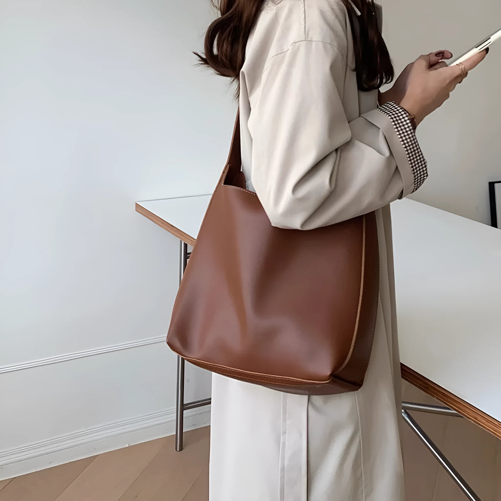 Women's black PU leather shoulder bag with swing thread design and adjustable strap