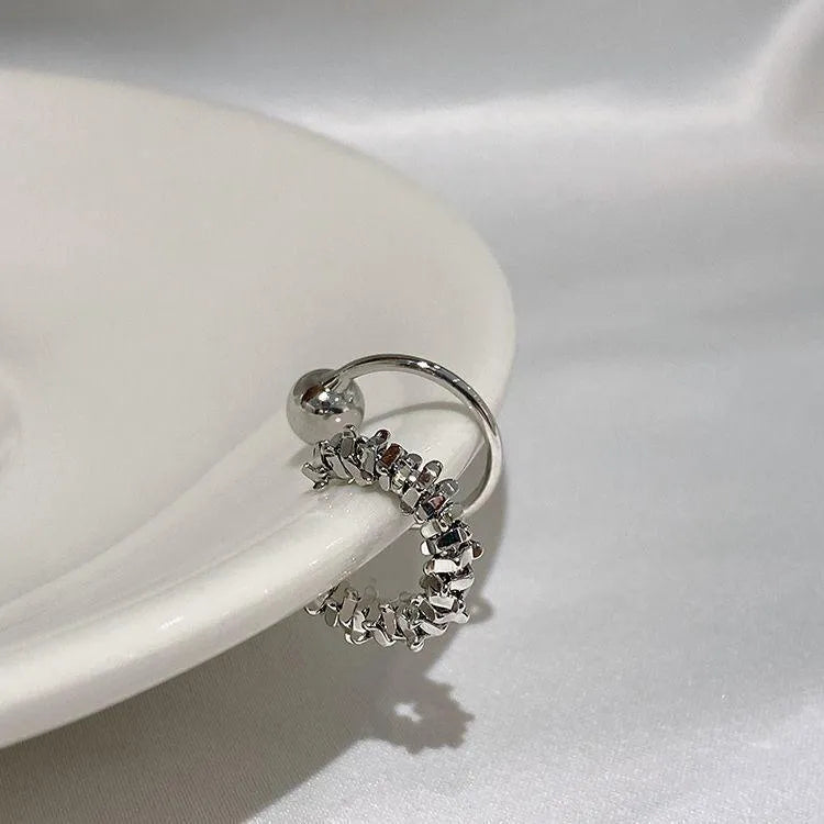 Frosty silver geometric ear clip earrings with irregular shapes