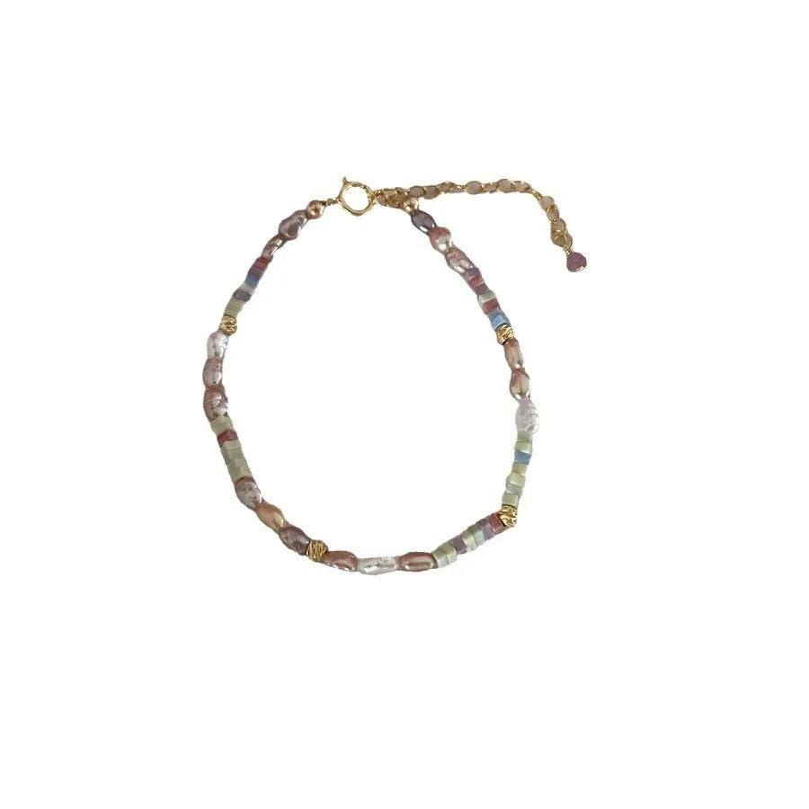 Natural pearl bracelet and necklace set with 14K gilded purple finish in irregular U-shaped design