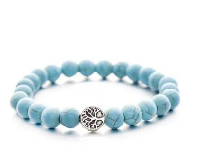 Alloy volcano white turquoise natural stone bracelet with adjustable cord on neutral background