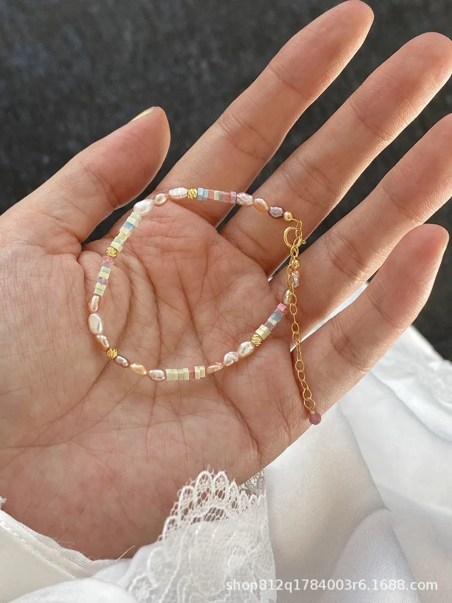 Natural pearl bracelet and necklace set with 14K gilded purple finish in irregular U-shaped design