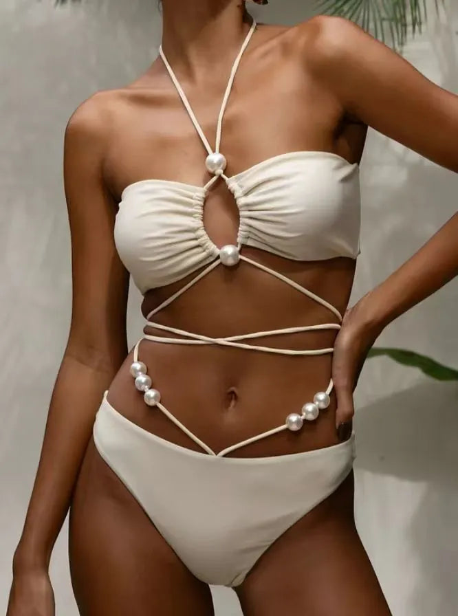 Women's split lace-up bikini swimsuit in black, two-piece set with bra and shorts on plain background