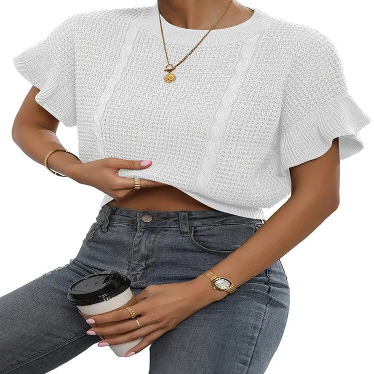 Loose fit knitted pullover with round neck and textured ruffled short sleeves in a neutral colour.