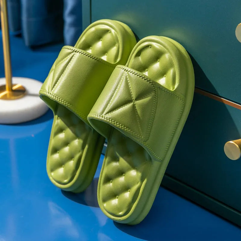 Soft EVA bath slippers in multiple colours showing thick non-slip sole.