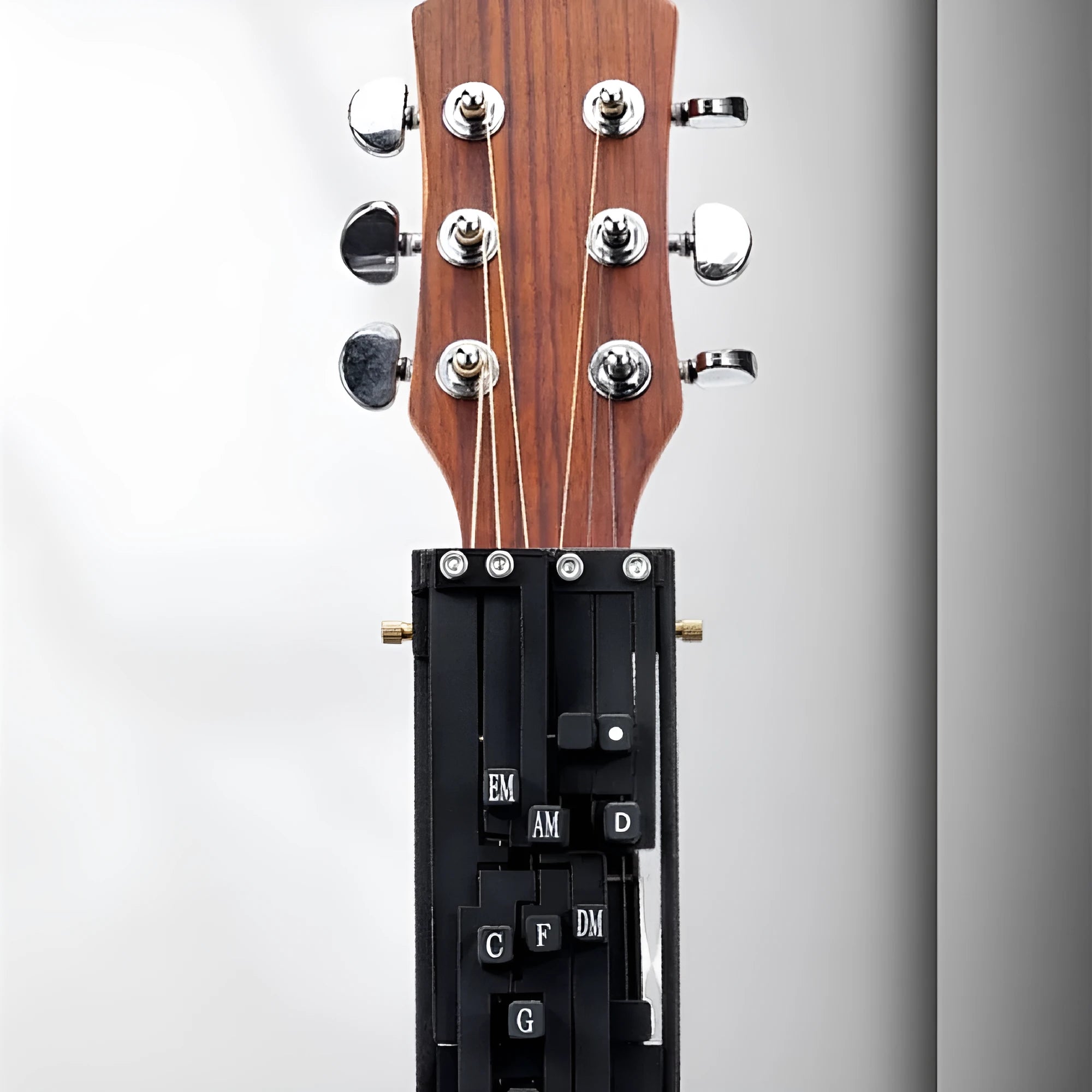 Black guitar chord changer device with automatic gear mechanism for beginner practice
