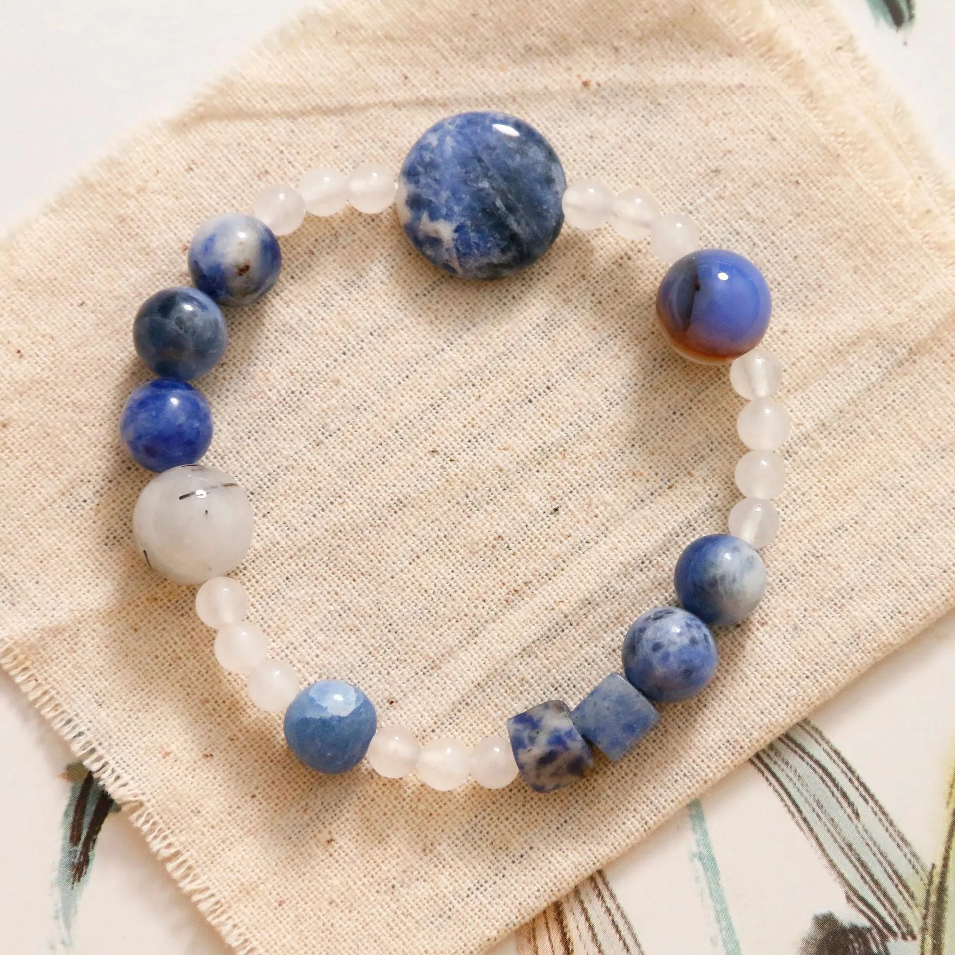 Natural blue point stone and black hair crystal agate hand-woven unisex bracelet with round and oval geometric beads