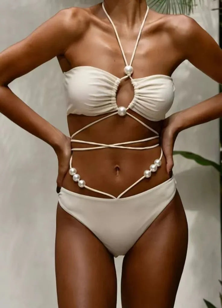 Women's split lace-up bikini swimsuit in black, two-piece set with bra and shorts on plain background