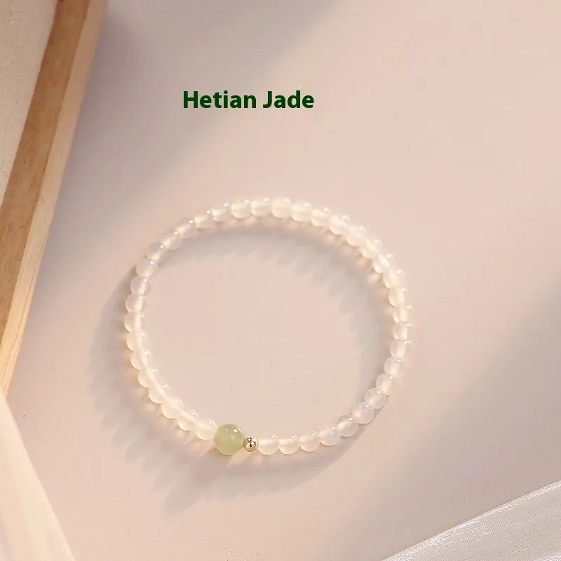 Natural Hetian Jade white agate women's bracelet 15cm on display showing banded white stones