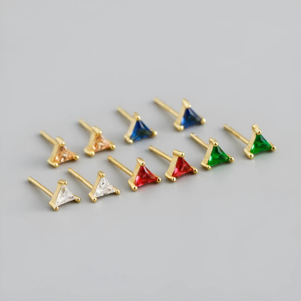 Simple triangle colour zircon stud earrings in 925 sterling silver with blue stone and gold needle on white background