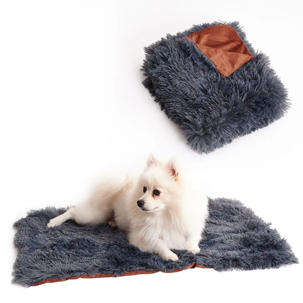 Light grey pet blanket made of velvet and long plush, with fluffy texture, on a sofa