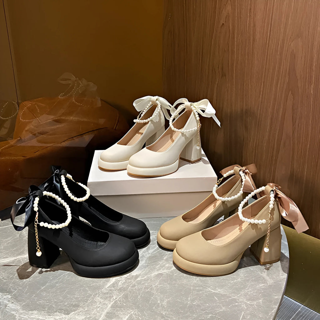 Beige women's Mary Jane shoes with chunky heel, ankle strap buckle, and pearl decoration on round toe