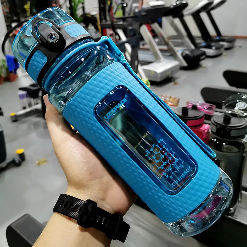 Portable sport water bottle in blue, copolymer polyester plastic, 1100ml capacity, with black cap.