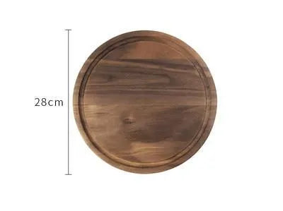 Black walnut wood cutting board with groove edge, rectangular shape, on kitchen counter