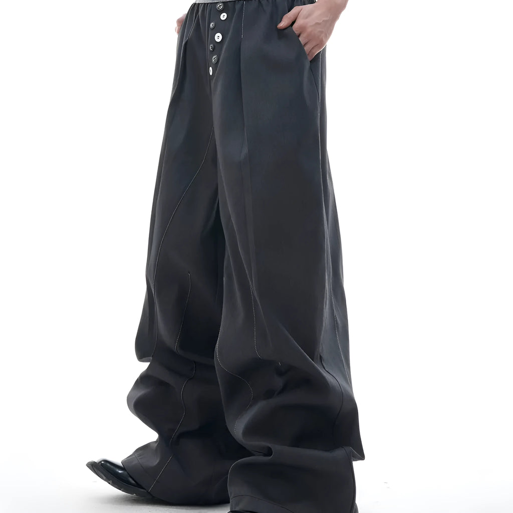 Drooping straight-leg high-waisted casual trousers with button detail in black and grey.