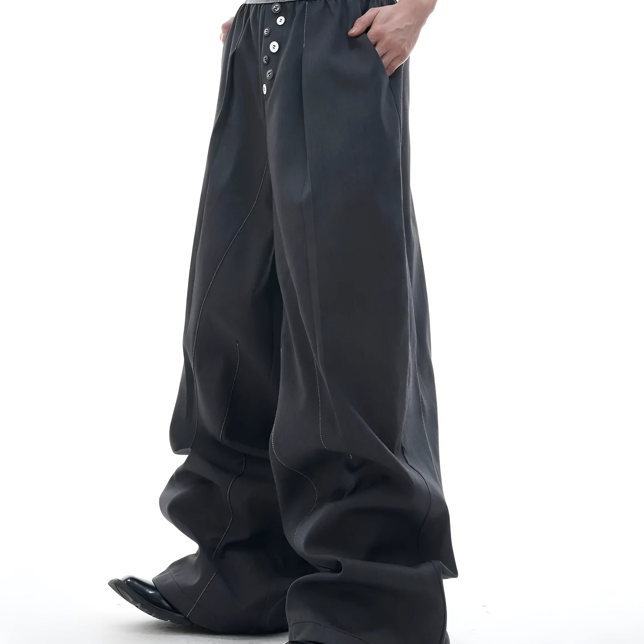 Drooping straight-leg high-waisted casual trousers with button detail in black and grey.