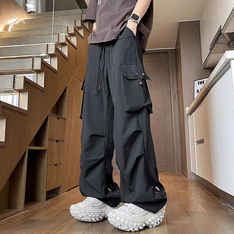 Plus size women's thin waterproof loose trousers in black, grey, and white.