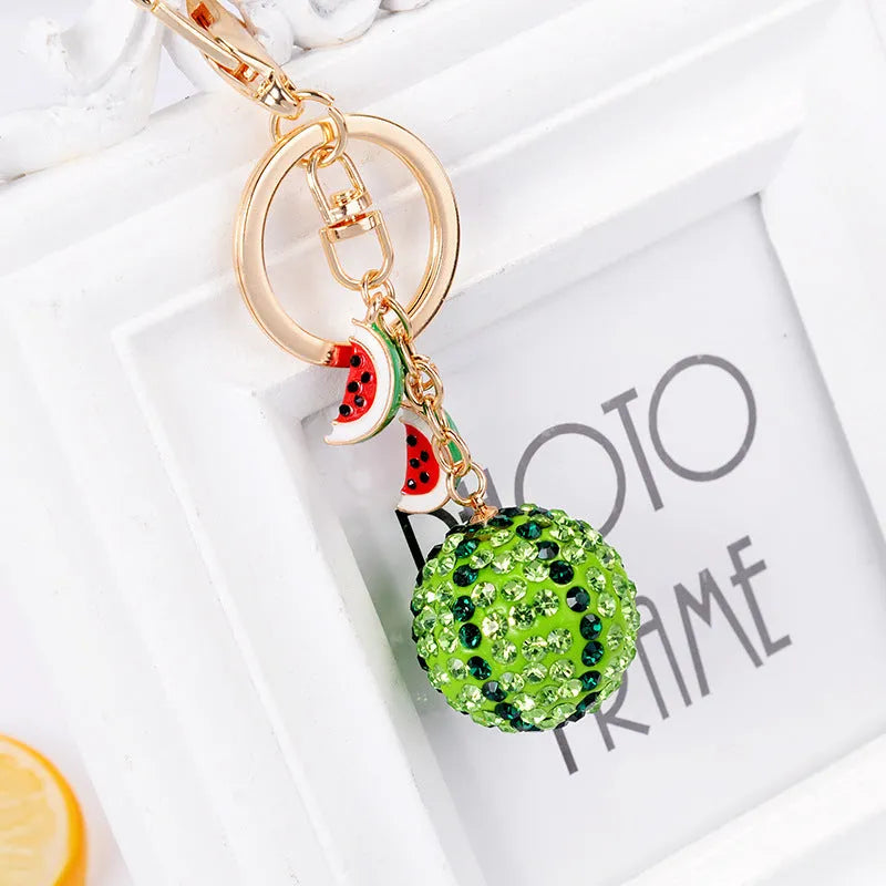 Green zinc alloy watermelon shaped keychain measuring 12cm with detailed fruit design