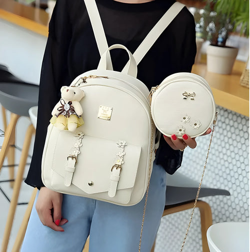 Three-piece women's bag set showing backpack, floral shoulder bag, and card holder in matching colour