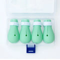 Four green silicone cat paw covers designed to prevent scratching and assist with pet handling
