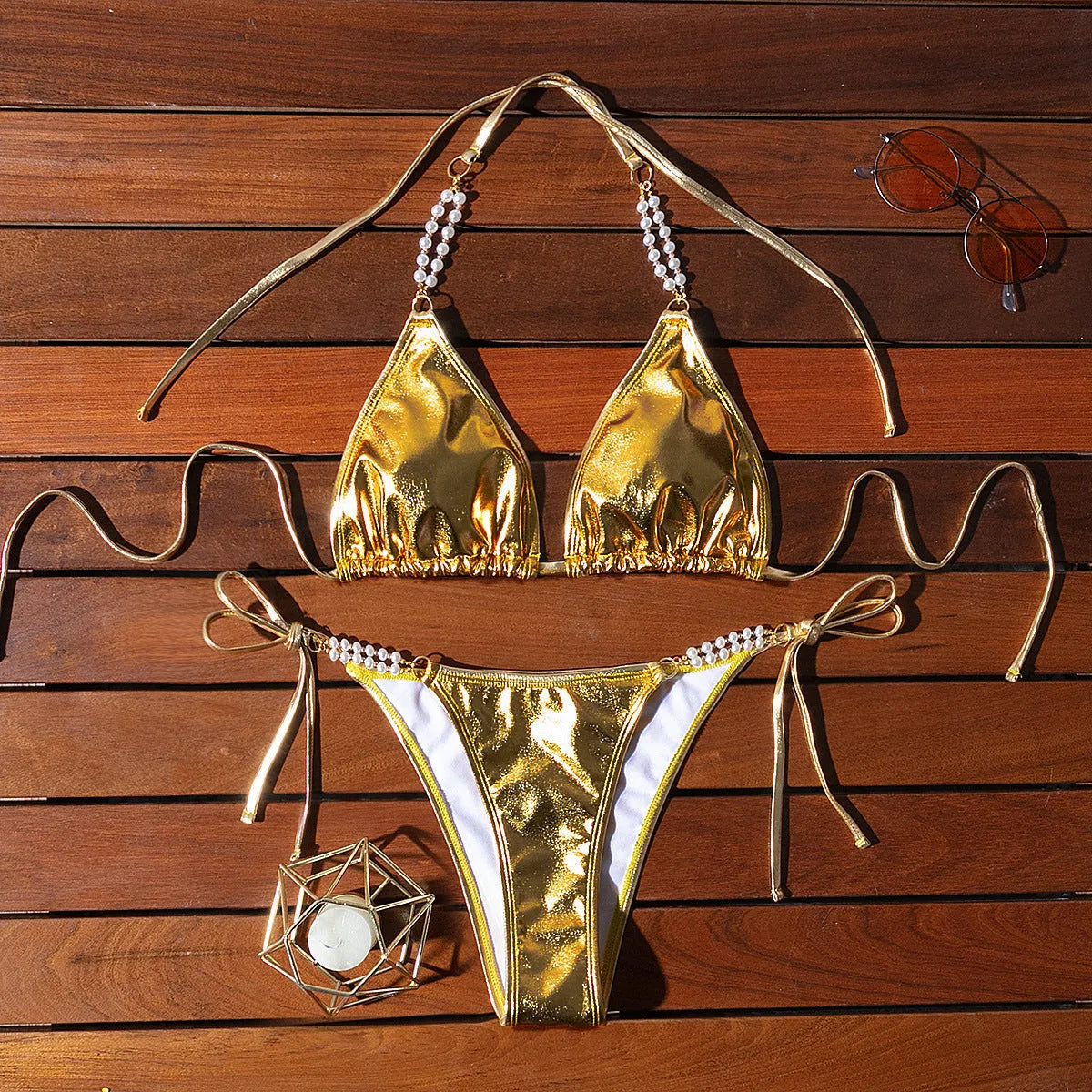 Gold halter lace-up bikini set with pearl chain detail for beach and pool wear