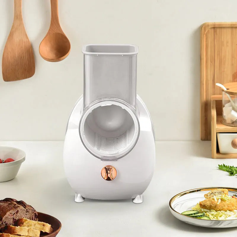Electric vegetable slicer with suction base in white, showing feeding port and pressing rod