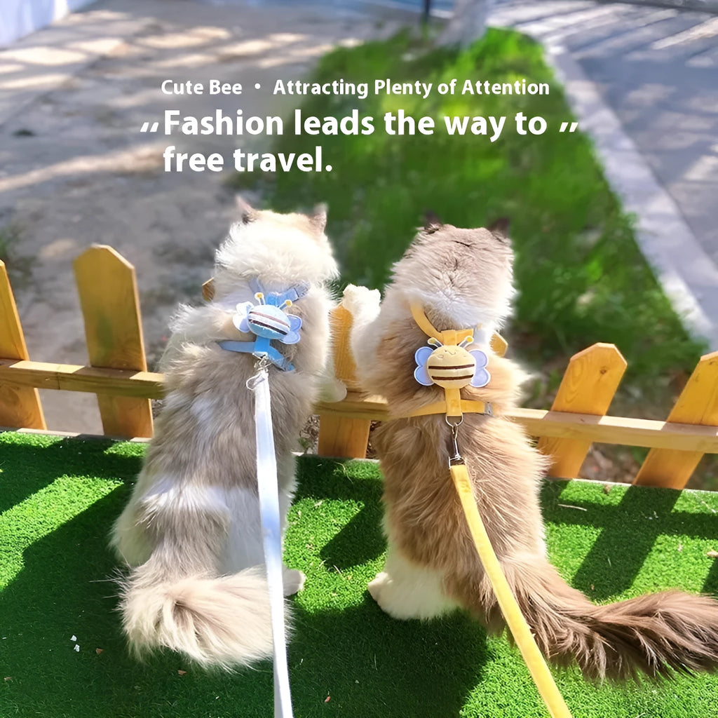 Bee-shaped pink cat collar and lead set for walking, shown with hand-held rope.