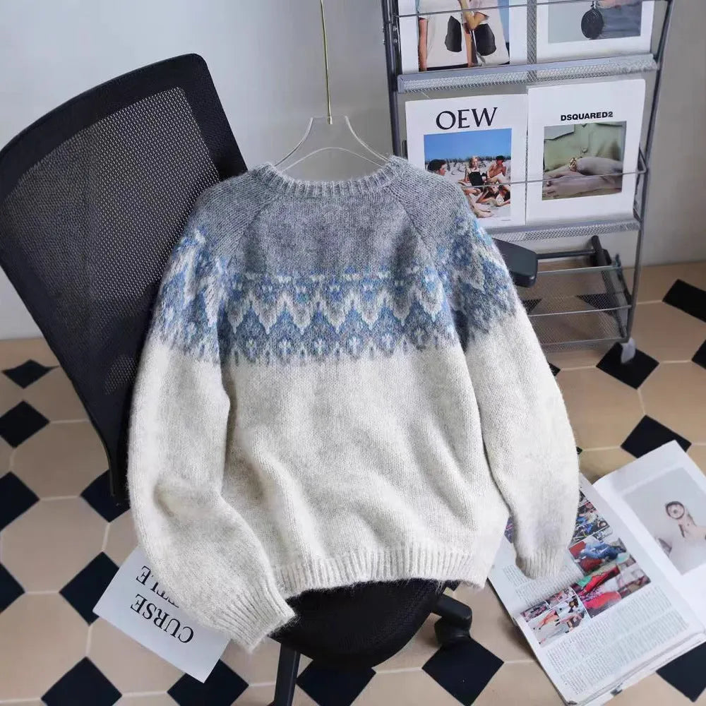 Women's jacquard knit sweater coat in a contrast colour, shown in a loose fit.