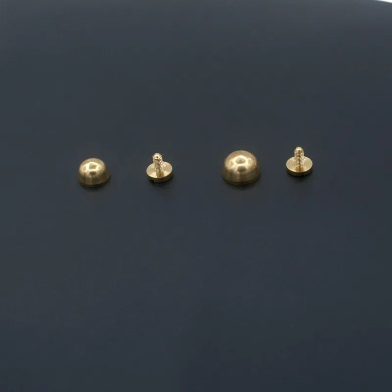Brass decorative buckle with antique foot nail design in four size variations