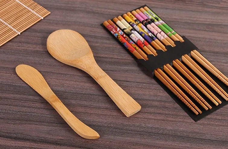 White sushi tool set with bamboo rolling mat and rice paddle for making sushi at home