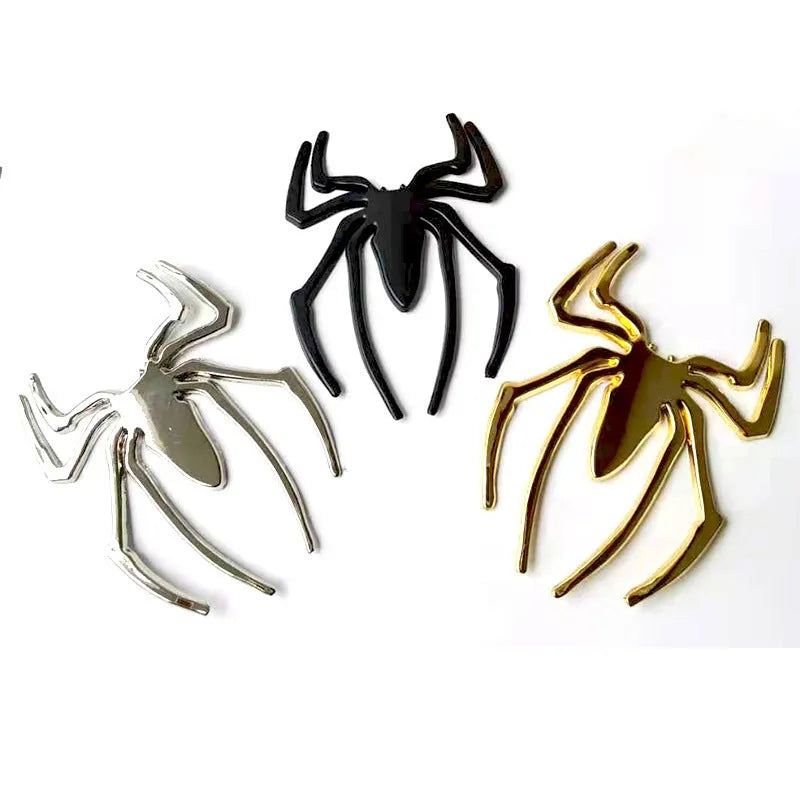 3D metal spider car bumper sticker in gold, silver, black, or red on a white background