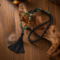 Natural stone beaded chain necklace with vintage tassel pendant and coordinating bracelet in bohemian retro style