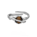 Adjustable Saturn and tigereye open ring in white gold colour electroplated silver