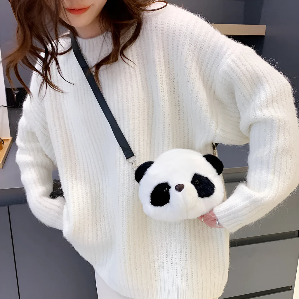 Soft plush crossbody bag with panda head design, cylindrical shape, and outer pocket.