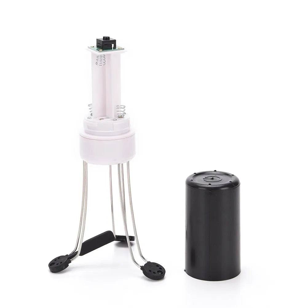 White and black wireless stir crazy mixer with stainless steel shaft on a kitchen countertop