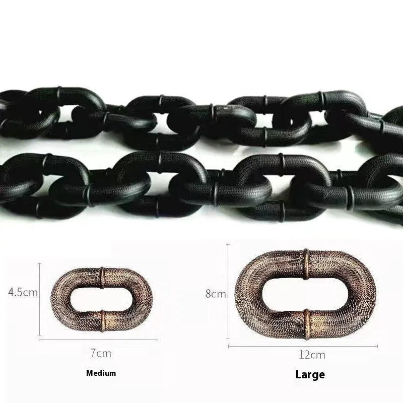Bronze coloured plastic dog leash simulation prop for video spoofs on a plain background.