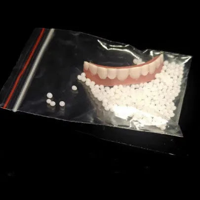 Silicone dental training dentures model showing upper and lower teeth simulation in tooth socket