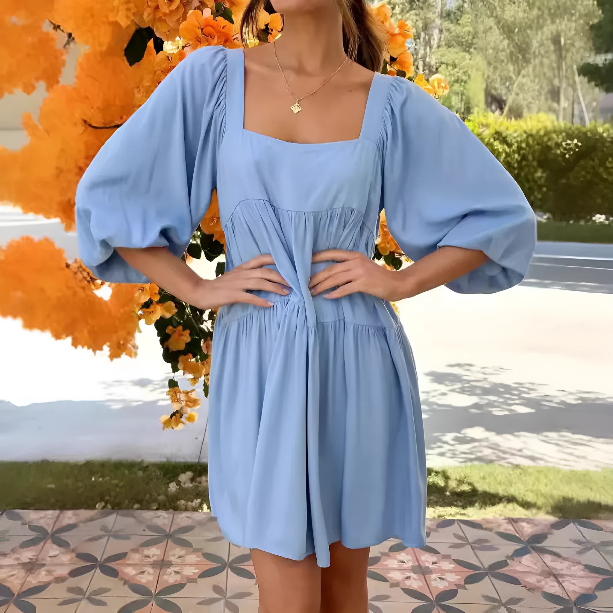 Orange children's backless dress with square collar and puff sleeves, showing A-line skirt.
