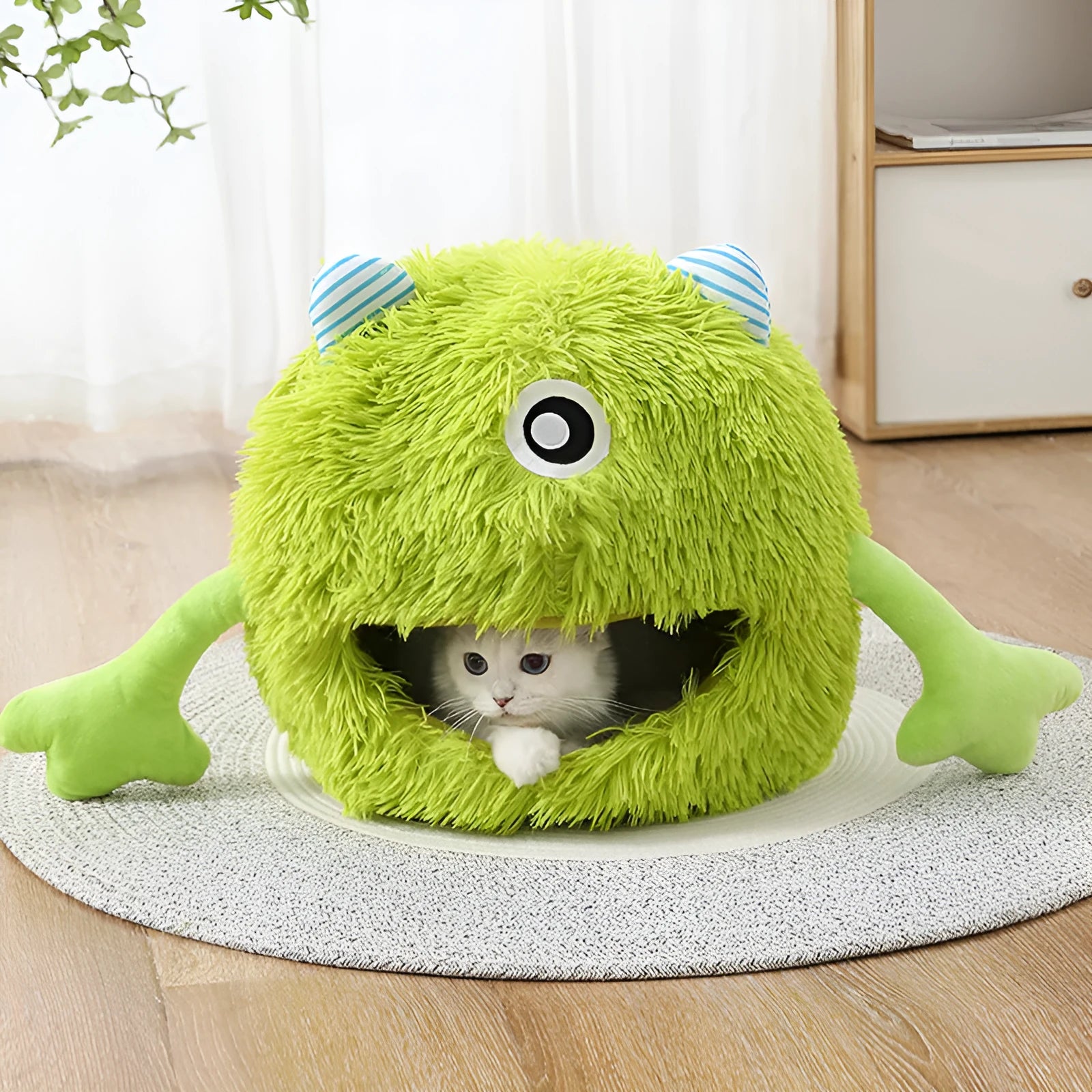 Round plush cat bed with non-slip base in three size options for indoor pets